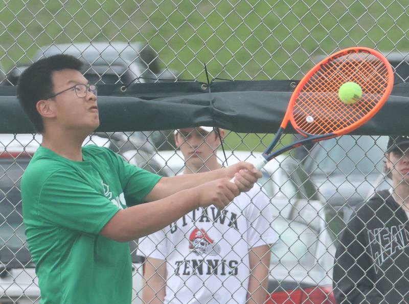 L-P's Kevin Guo returns a serve on Tuesday, April 21, 2026 in the Henderson-Guenther Tennis Facility at Ottawa High School.