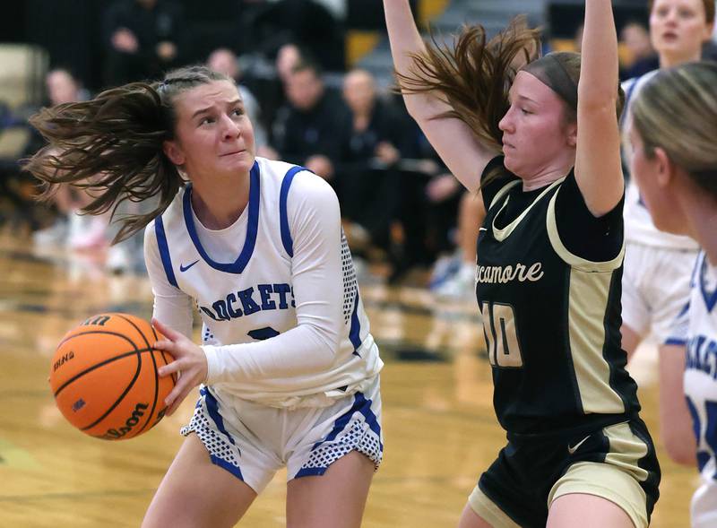 Burlington Central's Julia Scheuer looks to shoot against Sycamore's Cortni Kruizenga Thursday, Feb. 19, 2026, during their Class 3A regional championship game at Sycamore High School.