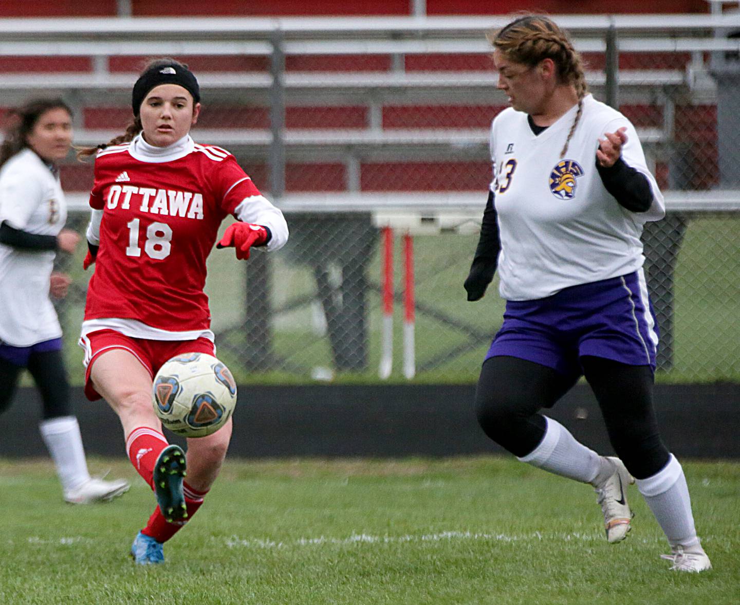 Ottawa's Gabi Krueger (18 kicks the ball up field as Mendota's as Mendota's Isabella Tolentino (13) defends on Monday, April 18, 2022 in Ottawa.