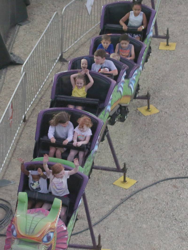 Kids ride the dragon roller coaster ride during the 168th annual Bureau County Fair on Saturday, Aug. 26, 2023 in Princeton.