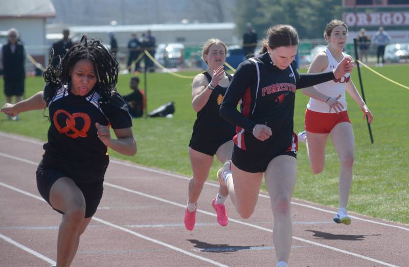 Forreston-Polo's Bree Schneiderman (right) finished third in the 100 meters behind Freeport's Taniah McElroy (left) at the Gebhardt-Worley Invitational at Oregon High School on Saturday, April 12, 2025.