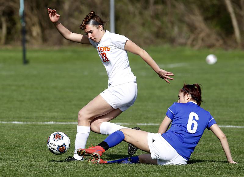 Dundee-Crown's Araceli Mendez, right, tries to kick the ball away from Crystal Lake Central's Jillian Mueller during a Fox Valley Conference soccer match Tuesday April 26, 2022, between Crystal Lake Central and Dundee-Crown at Dundee-Crown High School.