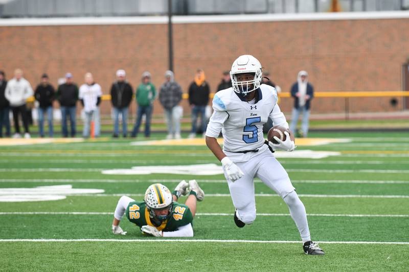 DePaul's Braden Peevy avoids a tackle by Coal City's Jacob Cerutti on Saturday, Nov. 23, 2024, during the Rams' 21-14 victory over Coal City in the IHSA Class 4A Playoffs semifinal game.