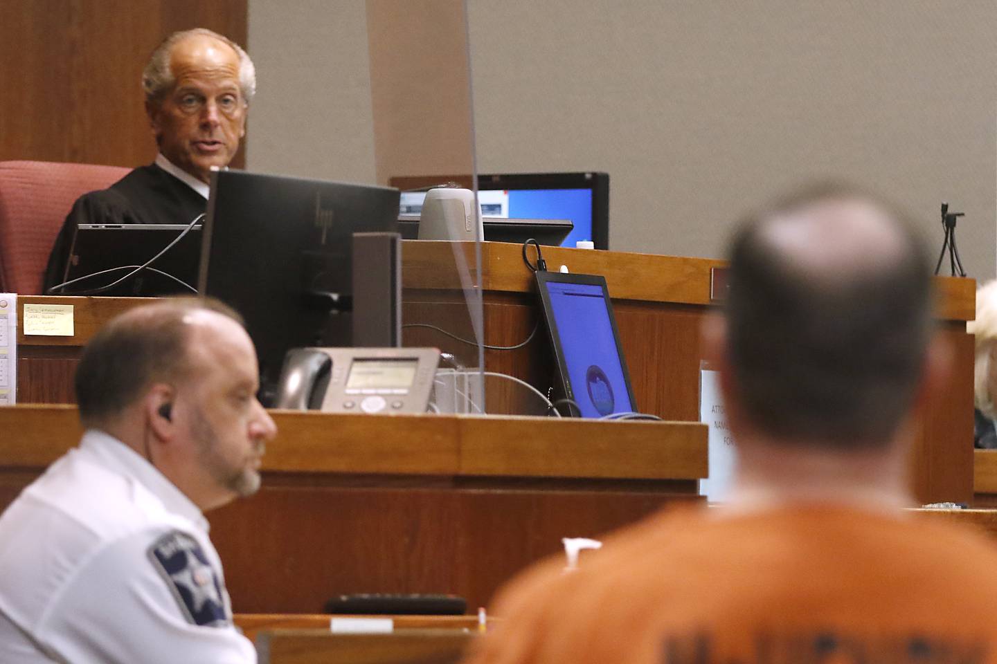 Judge Michael Coppedge talks with William Bishop during Bishop’s sentencing hearing on Thursday, Jan. 26, 2023, in the McHenry County courthouse in Woodstock.