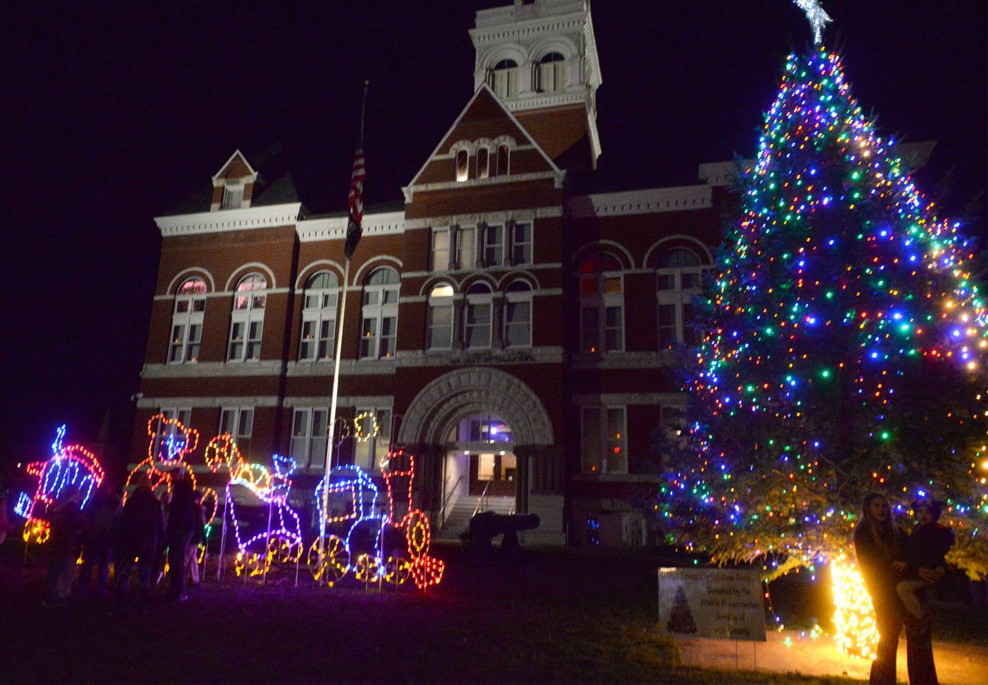 The official lighting of Oregon's Christmas tree was part of the evening festivities at Oregon's Candlelight Walk on Saturday, Nov. 25, 2023.. The event also included Christmas music, shopping specials, kids activities, horsedrawn wagon rides and visits with Santa.