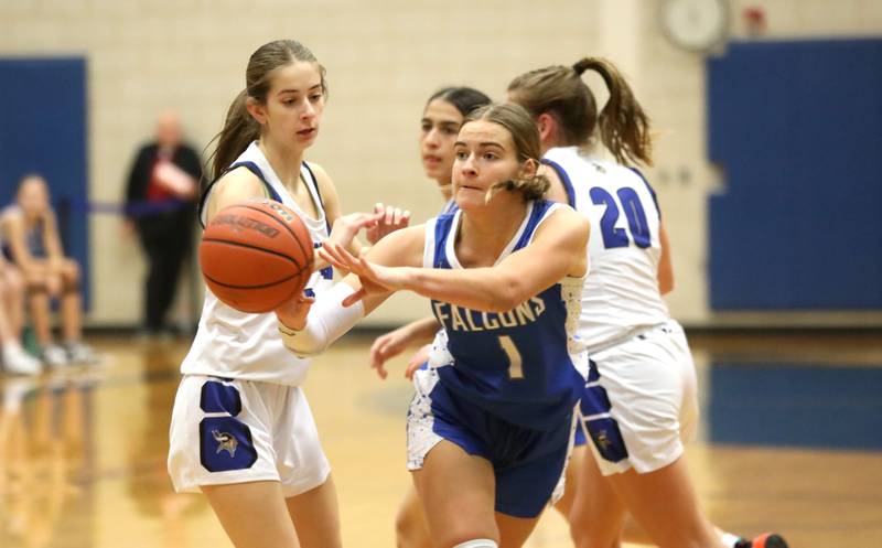 Wheaton North’s Zoey Bohmer passes the ball during a game at Geneva on Friday, Dec. 22, 2023.