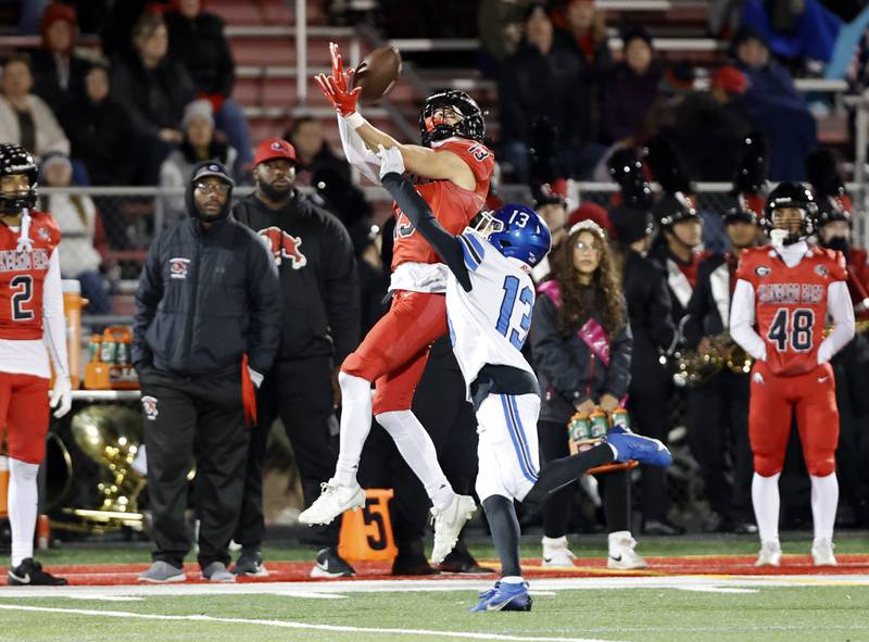 Glenbard East's Henry Benka (13) makes a catch during the varsity football game between Riverside Brookfield and Glenbard East on Friday, Oct. 24, 2025 in Lombard, IL.