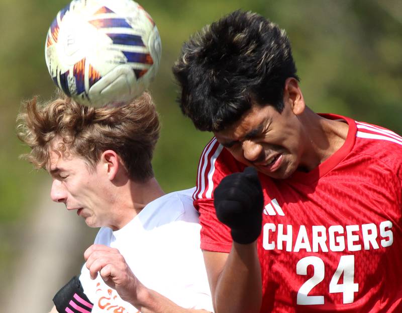 Dundee-Crown’s Angel DeLaTorre, right, battles St. Charles East’s Connor Sychowski for the ball in IHSA Class 3A Regional Championship soccer at Dundee-Crown High School in Carpentersville on Saturday, October 25, 2025.