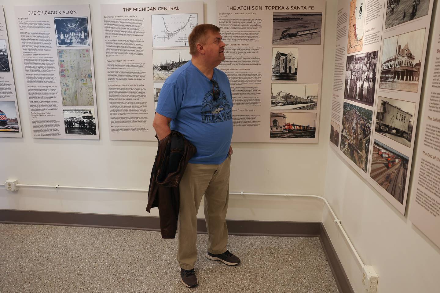 Jerry Lietz, a railroad enthusiast, reads about the history of the railroads in Joliet at the Joliet Railroad Museum located inside the old circa 1913 interlocking signal tower at the Gateway Center Train Station on Friday, May 10, 2024 in Joliet.