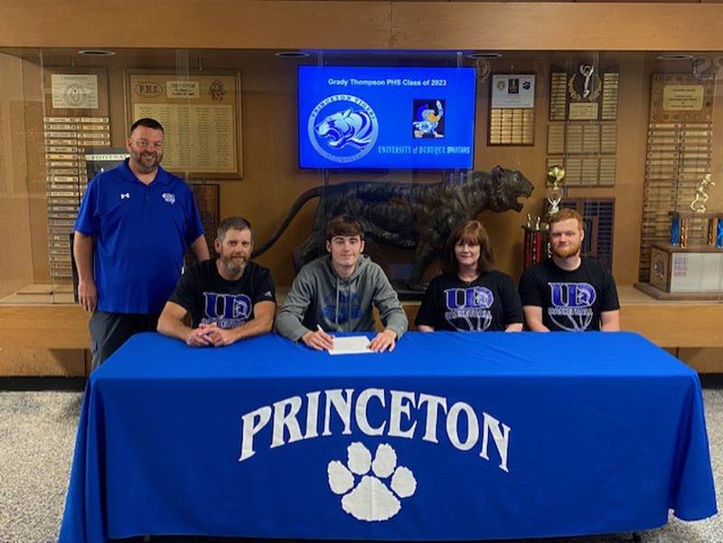Princeton High School senior Grady Thompson signs to play basketball for the University of Dubuque. He was joined by Tiger coach Jason Smith (left), his parents, Eric and Amy, and brother, Gabe. Thompson was the BCR Player of the Year.