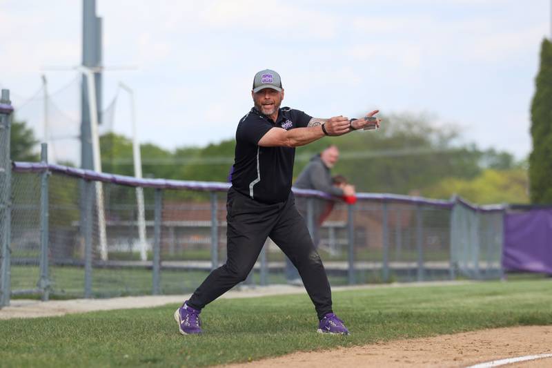 Manteno head coach Josh Carlile communicates with a batter during Manteno's 11-1 loss to Seneca on Friday, May 8, 2026.
