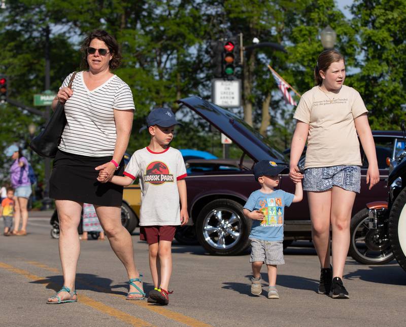 The Bienfeld family of Downers Grove looks at cars during the Moose Cruise Night at the Moose Lodge  in Downers Grove on Friday, June 3, 2023.