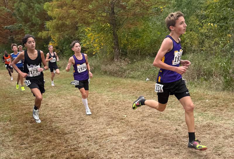 Dixon runner Myles Bautista (left) took third, finishing 2 minutes faster than last year with a two mile time of 10:43.