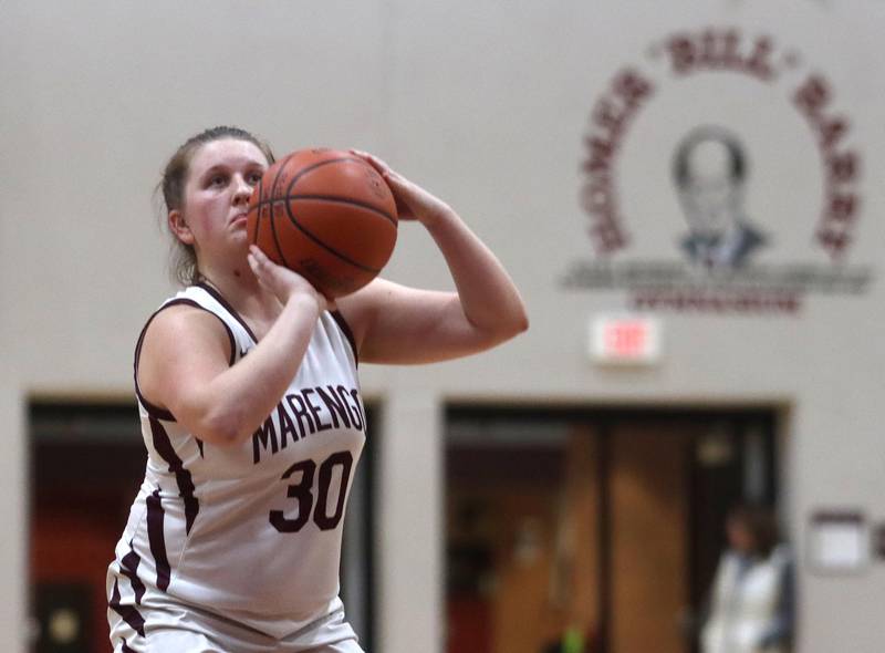 Marengo’s Addie Johnson makes a free throw against Woodstock North in girls basketball at Marengo on Thursday.
