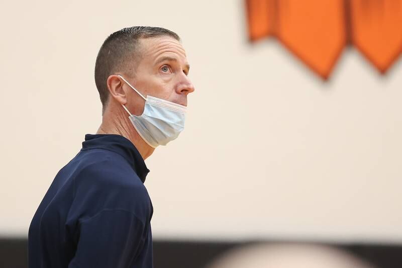 Lemont head coach Rick Runass looks at the clock during the game against Neuqua Valley in the Warrior Showdown shootout at Lincoln-Way West. Saturday, Jan. 29, 2022 in New Lenox.