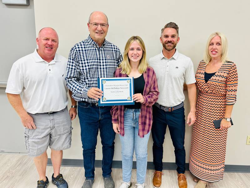 The Minooka-Channahon Rotary Club presents Lauren McPhillips-Newcomb with a certificate honoring her as the September Student of the Month.
