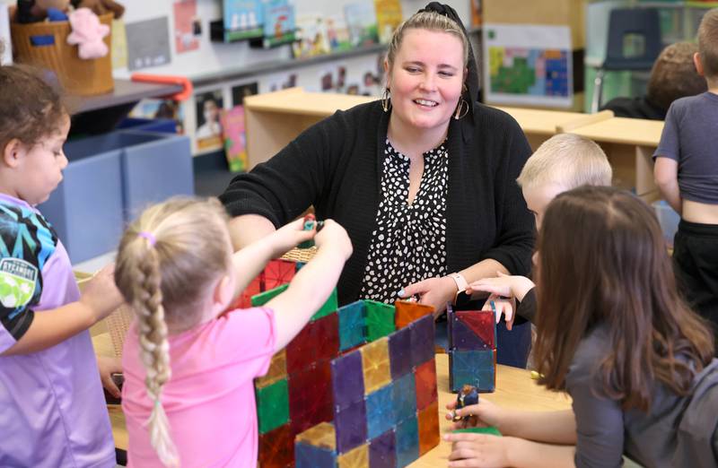 Laurel Copeland, Little Spartans Early Learning Program teacher at South Prairie Elementary School, works with students Wednesday, April 6, 2023, at the school in Sycamore.