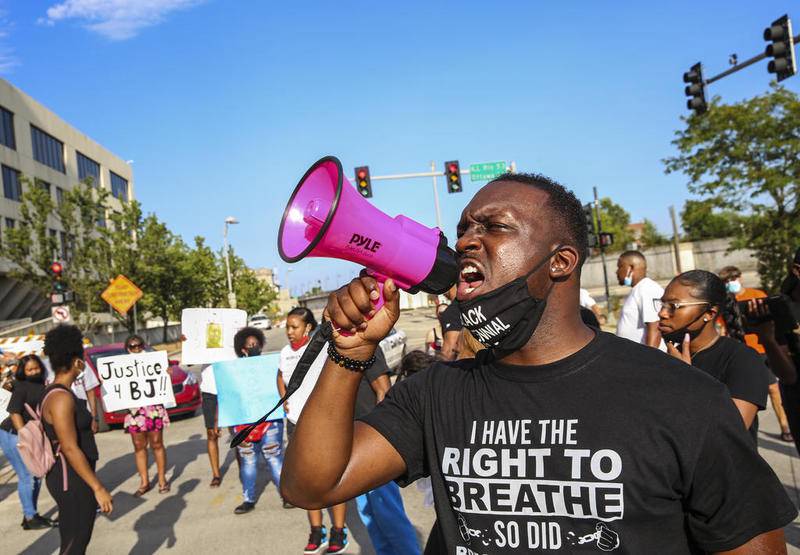 Demonstrators can be seen protesting outside Joliet City Hall, the Will County Courthouse and the Joliet Police Department on Saturday, Aug. 22, 2020, in response to the January 28 overdose death of Eric Lurry who died in police custody.
