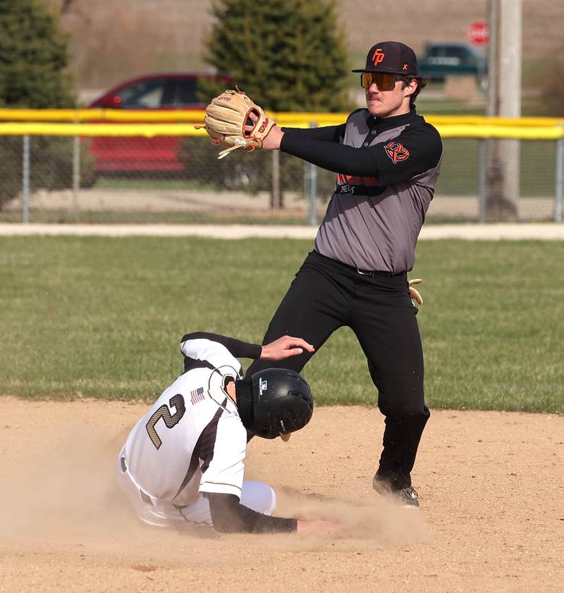 Sycamore's Ryker Rissman is forced out at second by Freeport's Ashton Roelfs Tuesday, April 7, 2026, during their game at the Sycamore Community Sports Complex.