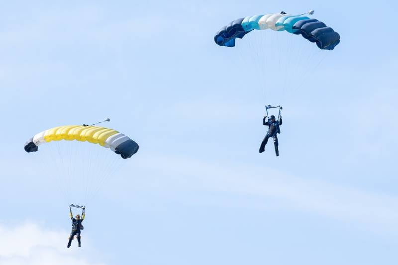 Skydivers glide towards drop zone on Friday, Aug 22, 2025 above Skydive Chicago in Ottawa.