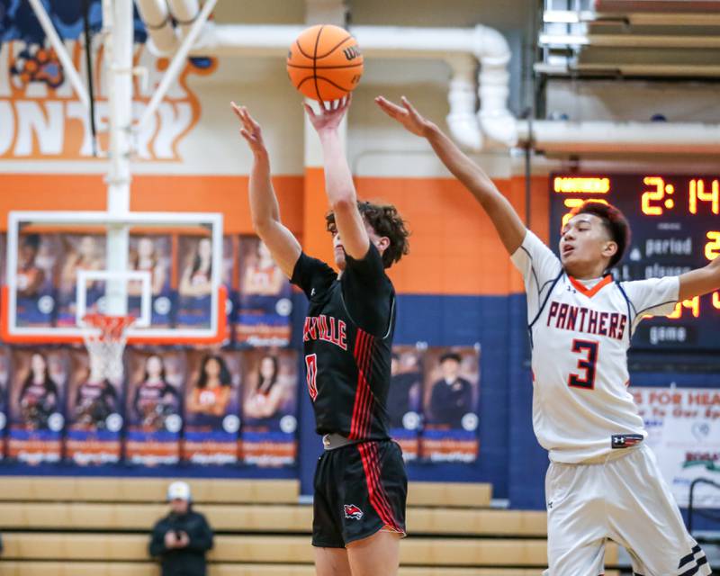 Yorkville's Gabe Sanders (0) shoots a jumper during their basketball game between Yorkville at Oswego, Tuesday Dec 10, 2024 in Oswego.