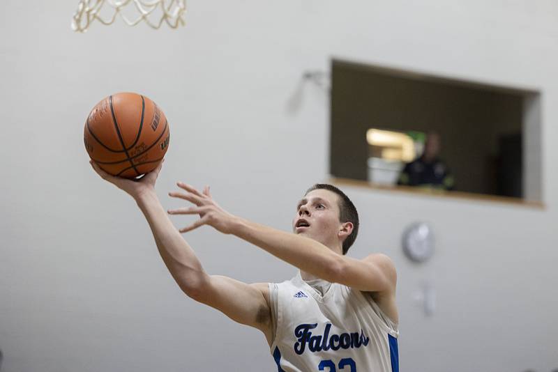 Faith Christian’s Logan Baker puts up a shot against QC Christian Tuesday, Dec. 9, 2025.