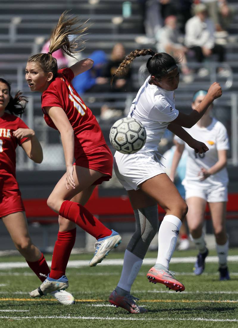 Batavia's Reese Recker and Neuqua Valley's Safa Jeffery (15) Saturday April 8, 2023 in Batavia.