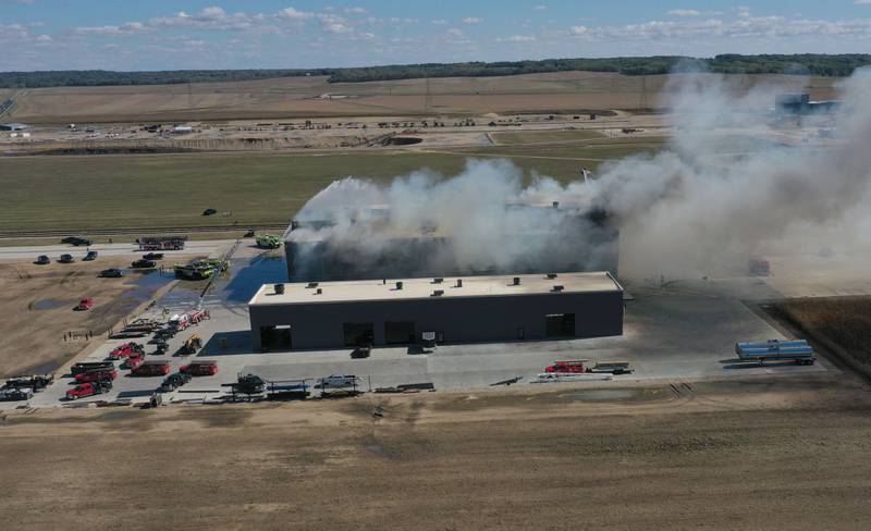 Smoke billows from Marquis Energy as firefighters work to control a structure fire on Wednesday, Oct. 8, 2025 in Hennepin. The fire was upgraded to a 5th alarm dispatching the (MABAS) Mutual Aid Box Alarm System. The fire broke out around 11a.m.