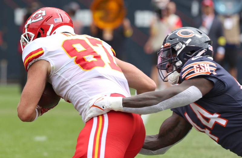 Chicago Bears linebacker Matt Adams brings down Kansas City Chiefs tight end Travis Kelce Sunday, Aug. 13, 2022, during their game at Soldier Field in Chicago.