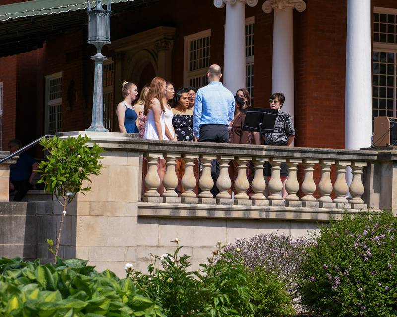 Members of the DeKalb High School Varsity Treble Choir sings during the Memorial Day ceremony held on the Ellwood house lawn in DeKalb on Monday May 30th.