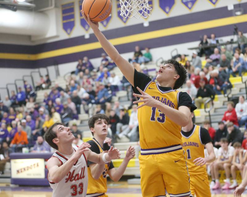 Mendota's Oliver Munoz does a reverse layup over Hall's Braden Curran on Tuesday, Feb. 3, 2026 at Mendota High School.