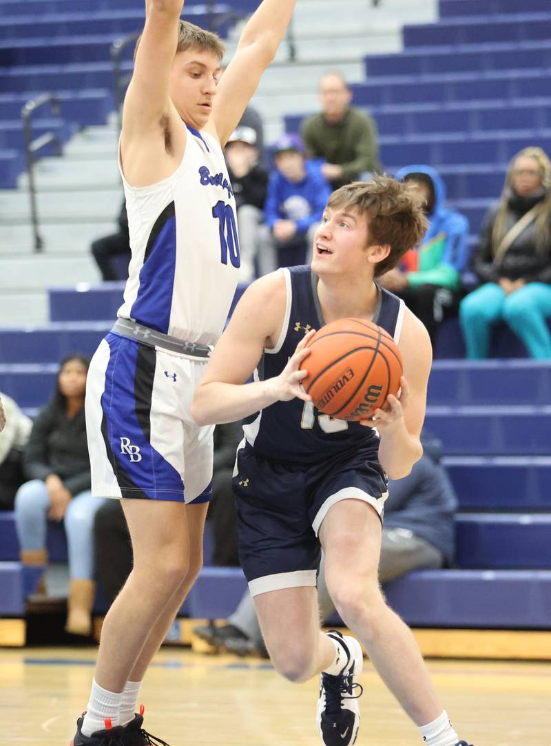 ICCP's Kal Kilgast (15) tries to get around Riverside Brookfield's Arius Alijosius (10) during the boys varsity basketball game between IC Catholic Prep and Riverside Brookfield in Riverside on Tuesday, Jan. 24, 2023.