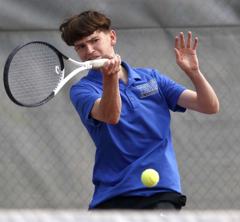 Lincoln-Way East’s Sam Cooley returns the ball as he and his doubles partner, Quinn Paris, compete in the Class 2A Boys State Tennis Tournament on Thursday, May 29, 2025, at Palatine High School.
