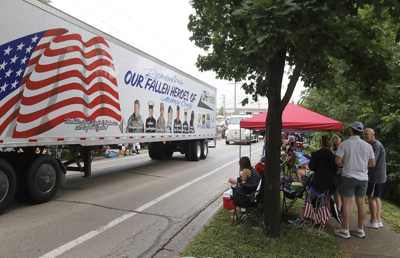 A truck honoring McHenry County’s Fallen Heroes passes parade watchers Sunday, July 2, 2023 during Crystal Lake’s annual Independence Day Parade on Dole Avenue in Crystal Lake. This year’s parade feature close to 100 units.