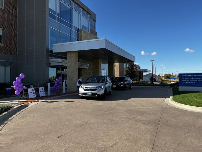 Cars line up at a 2021 National Prescription Drug Take Back Day drop-off site at Northwestern Medicine Huntley Hospital.