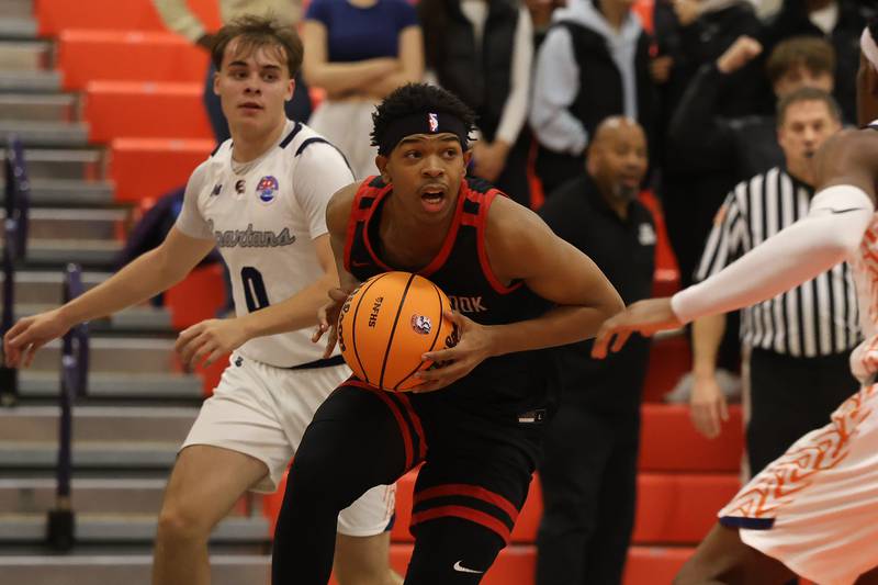 Bolingbrook's Isaiah Rogers works under the basket against Romeoville on Tuesday, Dec. 2, 2025 in Romeoville.