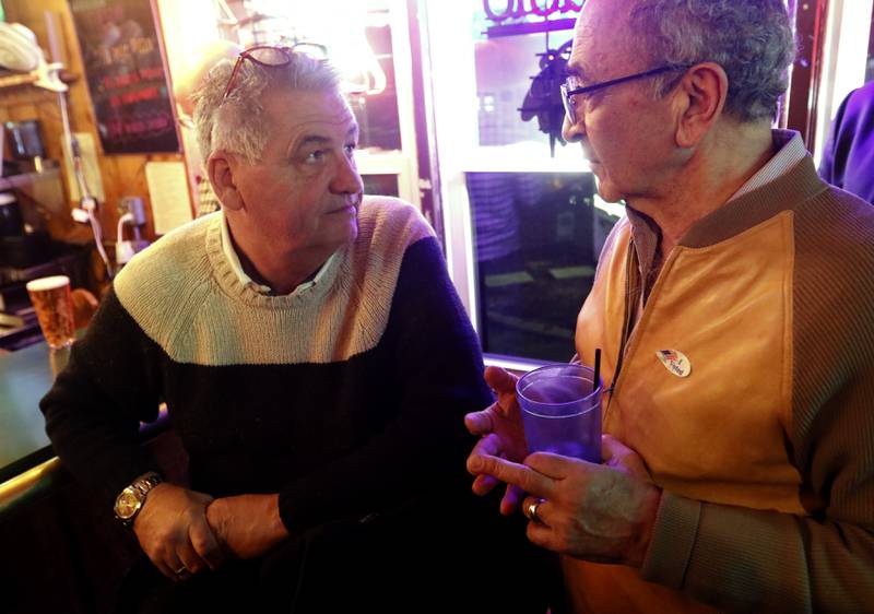 Crystal Lake Mayor Haig Haleblian (left) talks with Paul Leech, the owner of Cottage, during an election watch party for Crystal Lake Mayor Haig Haleblian and candidates for Crystal Lake's City Council at the Cottage Tuesday, April 4, 2023, in Crystal Lake.