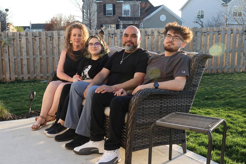 The Reyes family, Stacey (left), Lizzie, Felix and Nicholas pose for a photo in their backyard on Wednesday, April 12, 2023 in Joliet.