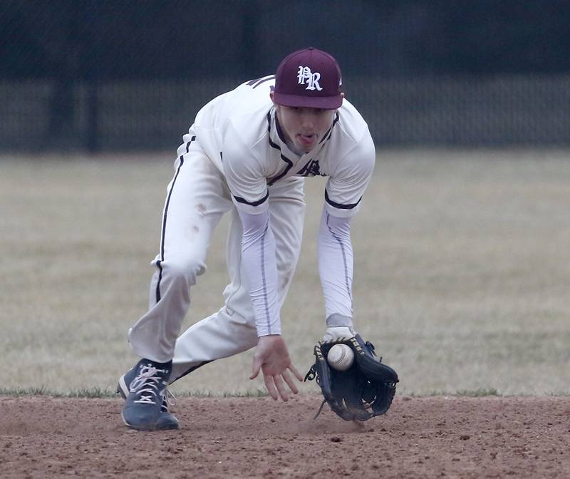 Prairie Ridge's Tyler Vasey fields a ground ball during a non-conference baseball game Tuesday, March 29, 2022, between Prairie Ridge and Fremd at Prairie Ridge High School.