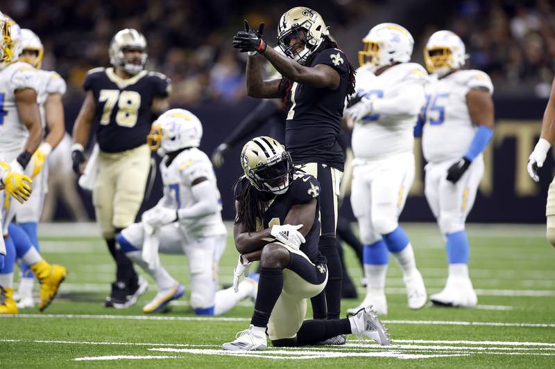 New Orleans Saints running back Alvin Kamara (41) and wide receiver Marquez Callaway (1) react to a play during an NFL preseason football game against the Los Angeles Chargers, Friday, Aug. 26, 2022, in New Orleans. (AP Photo/Tyler Kaufman)