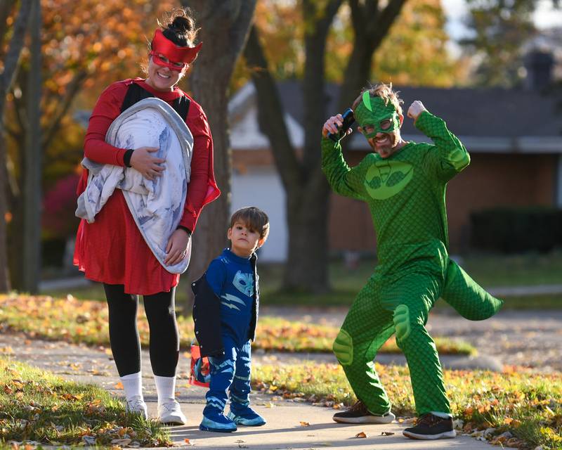 The Padgett family (from left) Emily, baby Rhys, Alden, 3, and Greg, all pose for a Halloween photo on Thursday, Oct. 31, 2024, while trick-or-treating in DeKalb.