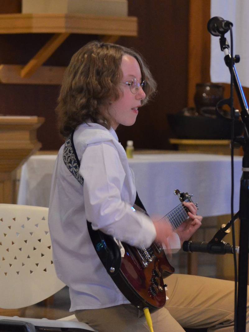 Jake Andrzejewski performs a guitar piece during Woodlawn Arts Academy’s spring music recital at St. Paul LutheranChurch, Sterling.