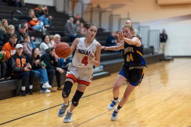 Sandwich sophomore guard Hannah Treptow (4) drives to the basket during a game in the 2022-2023 season.