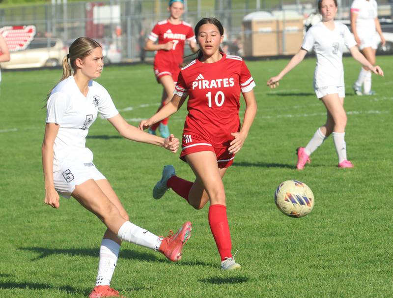 Kaneland's Sophkicks the ball past Ottawa's Brooklyn Byone on Wednesday, April 22, 2026 on King Field at Ottawa High School.