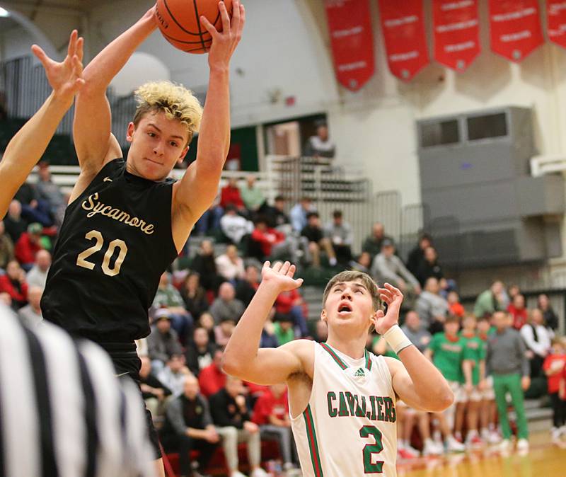 Sycamore's Thatcher Freidrichs grabs a rebound over L-P's Seth Adams on Tuesday, Jan. 31, 2023 at L-P High School.