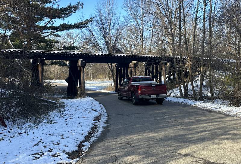 A motorist travels under the train bridge that crosses over 3575 East Street near Spring Creek on Monday, Nov. 27, 2023 near Spring Valley.