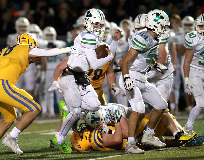 York quarterback Sean Winton keeps the ball during the Class 8A second round football playoff game against Lyons Township in Western Springs on Saturday, Nov. 4, 2023.