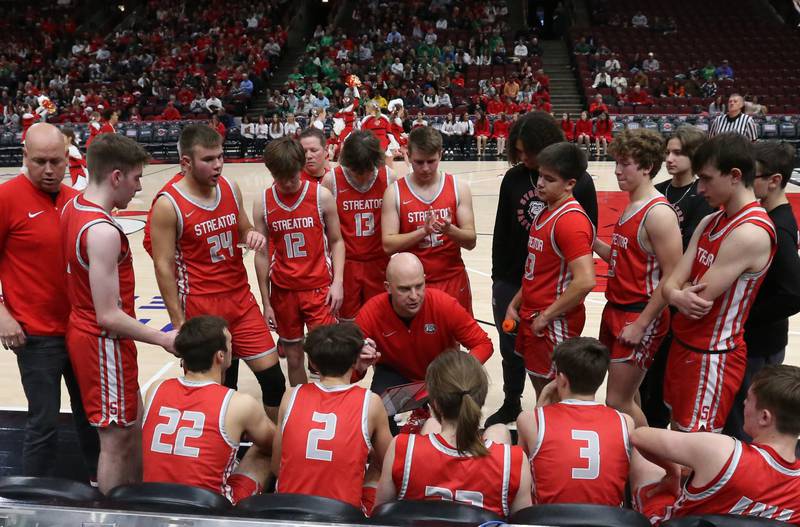 Streator head boys basketball coach Beau Doty talks to his team during a timeout while playing Seneca during a game on Tuesday, Dec. 21, 2023 at the United Center in Chicago.