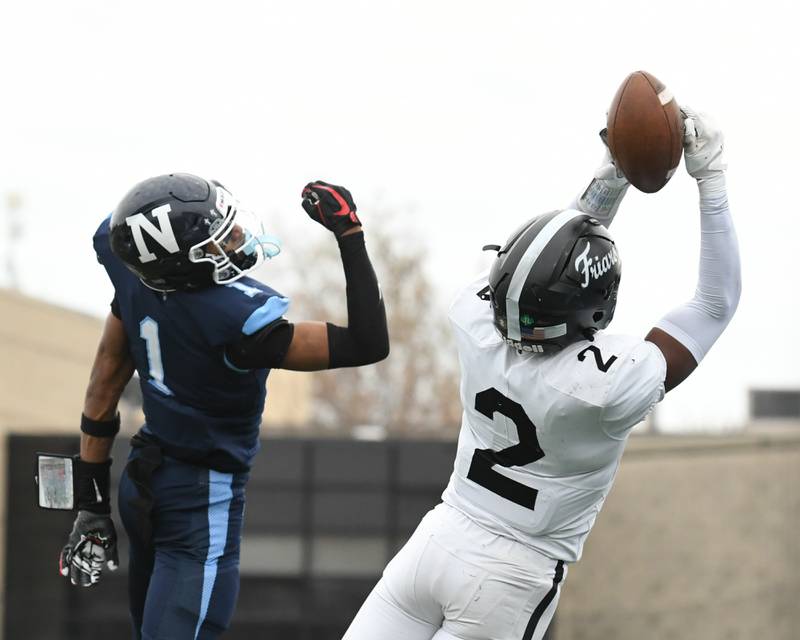Nazareth Academy's Trenton Walker (1) goes up for a pass while Fenwick's Josh Morgan (2) catches the ball for the interception during the 6A semifinals game on Saturday Nov. 22, 2025, held at Nazareth Academy High School in La Grange Park.
