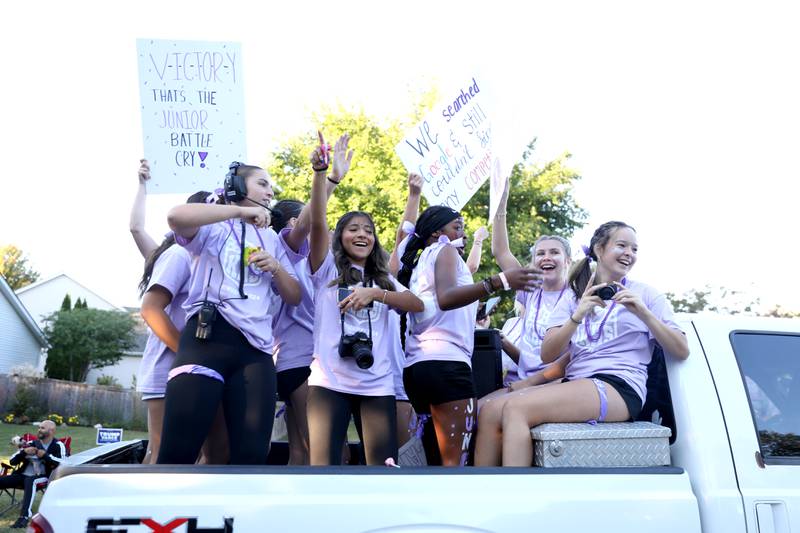 Kaneland High School students ride on a float on Wednesday, Oct. 2, 2024 during the school’s homecoming parade in Elburn.